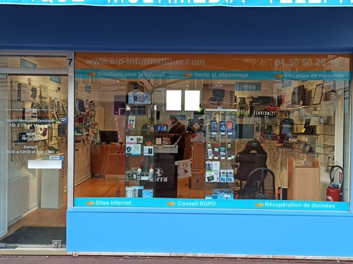 Vitrophanie en collage intérieur pour décorer la vitrine du commerce ELP Informatique à Maurepas